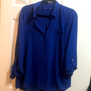 Two dress shirts. One never worn with tags.